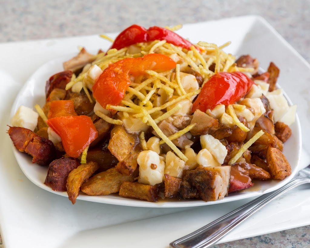 Poulet 3 Pattes | 3224 Boulevard Rosemont, Montréal, QC H1Y 1M7, Canada | Phone: (438) 387-6477